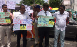 Senior Counsel Ralph Ramkarran (second from right) and other supporters on the picket line at midday yesterday.
