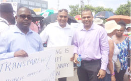 Former Minister of Culture, Youth and Sport Dr Frank Anthony (right) was one of several political figures who made an appearance in support of the parking meter protest.
