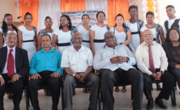 Minister within the Ministry of Social Protection Keith Scott (third from left), Regional Chairman, Region 3 Julius Faeber (second from left) and representatives of the BIT and the Leonora Technical & Vocational Training Centre surrounded by graduates of recently concluded National Training Programme for Youth Empowerment (NTPYE).
