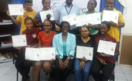 Jennifer Flatts (seated centre) with a batch of class of Elegance trainees