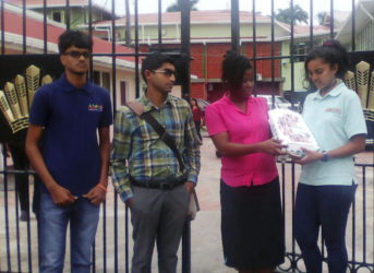 Students of the School of the Nations accompanied by school staff deliver to the Ministry of the Presidency a petition calling for the removal of Value Added Tax from private education. From left are: Richard Bhainie, Director of Student Services Anil Singh, Director of Academics Taslikeyah Fox and Dhavani Persaud.
