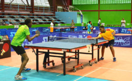 Caribbean Pre cadet 11 years and under champion Kaysan Ninvalle (right) about to make a return in his semi-final matchup against Nicholus Romain, in the handicap division of the Linden Forbes Sampson Burnham Memorial table tennis tournament yesterday at the National Gymnasium. (Orlando Charles photo)