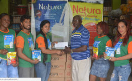 Samuel Thornton of the NPSCA collects the sponsorship cheque from Navita Dabicharran.
