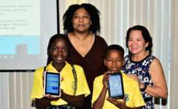 First Lady Sandra Granger (right) poses with Co-founder of STEMGuyana Karen Abrams (left) and two Grade Six pupils who attended the launch. (Ministry of the Presidency photo)
