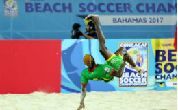 Guyana’s Jamal Haynes in the process of scoring a spectacular overhead kick goal against Antigua and Barbuda in the CONCACAF Beach Soccer Championship in The Bahamas. 
