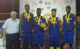 Team Guyana (from left) Timothy Thompson, captain Stanton Rose, Jonathan Mangra and Jamal Gilkes display their silver medal alongside FIBA Americas President Horacio Muratore (left) following the conclusion of the IBF Lesser Antilles 3X3 Championships.