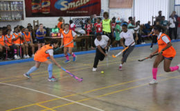 St Joseph’s Akeela Ralph (centre) initiates a counterattack against Marian Academy during their matchup in the Smalta U14 Indoor Hockey League Friday at the Marian Academy auditorium.