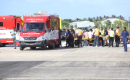 Passengers with serious injuries being moved to an ambulance to be transported to  the hospital. (Keno George photo)