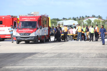Passengers with serious injuries being moved to an ambulance to be transported to  the hospital. (Keno George photo)