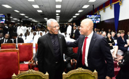 Former Haitian President Michel Martelly (right) greeting President David Granger