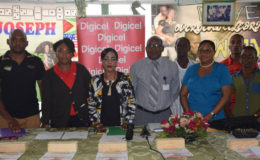 Faye Joseph, president of the Georgetown Dominoes Association (GDA)  third from left and Louanna Abrams, Digicel’s Events and Sponsorship executive with officials of the GDA at yesterday’s launch.