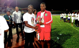 Captain of the Guyana National U17 squad collects the Fair Play Award at the Tournoi Paul Chillan in Martinique.
