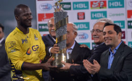Peshawar Zalmi captain Darren Sammy receives the PSL trophy following Sunday’s final against Quetta Gladiators in Lahore.
