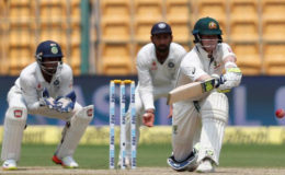 Australia captain Steve Smith, above, has been accused of crossing the line by India’s Virat Kohli, after he was caught looking towards the Australia dressing room prior to deciding whether to review the umpire’s decision after he was given out lbw. (Reuters photo)

