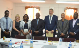 The panel at yesterday’s handing over of the E-Visa Report by the European Delegation to the Ministry of Citizenship. (From left): Lucas Guedes, IOM consultant; Jermaine Grant, IOM Programme Officer; Patricia Bell, IOM consultant; Dr Karen Cummings, Minister within the Ministry of Public Health; Winston Felix, Minister of Citizenship; Jernej Videtic, Ambassador, Head of the Delegation of the European Union to Guyana; Dominic Gaskin, Minister of Business; Dale Alves of the Department of Immigration and Ingrid Primo, Head of the Immigration Support Services.