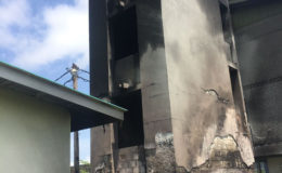 Photos showing the aftermath of the fire that occurred yesterday at the Digicel-owned generator room located on the southern side of the recently refurbished Faculty of Health Sciences building on the Turkeyen campus. The now empty metal cage, in the foreground, held the plastic tank.
