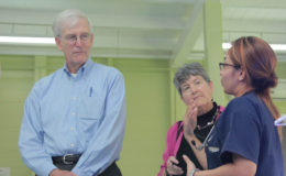 Andrew and Laurie Skipper in discussion with a hospital staffer (right) (Ministry of Public Health photo)