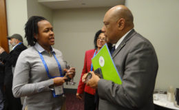 Natural Resources Minister Raphael Trotman engages Nikeita La Cruz, a Guyanese student studying Geochemistry at the University of Michigan during the Guyana Mining Day Seminar held at the Prospectors and Developers Association of Canada Convention in Toronto, Canada. Guyana’s High Commissioner, Clarissa Riehl is also in photo. (Ministry of Natural Resources photo)