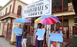 Part of the protest against the decision of Magistrate Dylon Bess to bar a transgender woman from his courtroom because of her clothing. (Photo by Keno George)