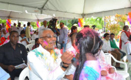 President David Granger and a young celebrant in Holi greetings (Ministry of the Presidency photo)
