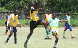Action between St. Mary’s Secondary and East Ruimveldt in the Milo U18 Secondary Schools football championships at the Ministry of Education ground, Carifesta Avenue.