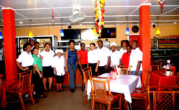 Vanessa Klass-Singh (centre in trousers) and part of the staff of the Hot and Spicy Restaurant