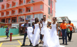 Models wearing wedding gowns paraded through the streets yesterday to publicise the Roraima Duke Lodge Annual Wedding Expo billed for March 24 to 26. (Photo by Keno George)
