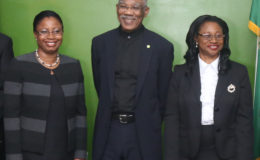 President David Granger is flanked by acting Chancellor Yonette Cummings-Edwards (at right) and acting Chief Justice Roxane George after they were sworn in  at State House. (Photo by Keno George)