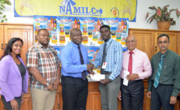 Petra Organization representative Mark Allen (3rd from right) collecting the sponsorship cheque from NAMILCO Financial Controller Fitzroy McLeod (3rd from left) while other members of the presentation party including Petra Organization Co-Director Troy Mendonca (2nd from left) and Assistant to the Managing Director Autamaram Lakeram (right) share in the moment. (Orlando Charles photo)
