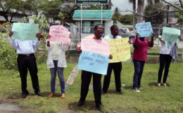 Some of the protestors outside GPSU yesterday as they fervently called for Patrick Yarde to be replaced as president of the union. (Photo by Keno George)