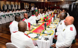 Officers seated in the dining hall at the Officers Club for dinner  (Ministry of the Presidency photo)