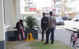Smart City Solution workers at the corner of Robb and Camp streets yesterday. (Photo by Keno George)
