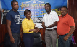 Petra Organization representative Mark Allen (2nd from right) collects the sponsorship cheque from Star Party Rentals Pheona Jones while Petra Organization Co-Director Troy Mendonca (right) and Star Party Rentals representative Colwin Vyphius look on.