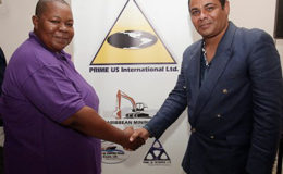 Chief executive officer, Prime US International Ltd., Stephanie Bonaparte-Primus , left ,poses for a photo with president and chief executive officer of Wylde Orchid Designs and Management Co. Ltd (Canada) during a joint press conference, Cascadia Hotel, St Ann’s on Wednesday.