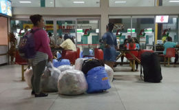 Cubans and their luggage awaiting the Easy Sky ride back home
