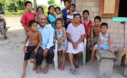 Christian and Margaret Xavier surrounded by a daughter and their grandchildren
