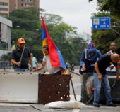 Opposition supporters bang a metal barricade during a rally against Venezuela’s President Nicolas Maduro in Caracas, Venezuela April 24, 2017. (Reuters/Carlos Garcia Rawlins)
