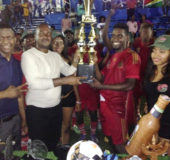 Oswald Benjamin (right), Captain of the newly crowned Linden ‘Stag Bowl’ Inter-Ward Football Champions, Silvercity Alleys and Valleys, receiving the championship trophy from GFF President Wayne Forde in the presence of the promoter Tallo Hudson (left), following their 1-0 win over Block 22 at the MSC Ground, Linden
