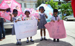 These young ones, accompanying their parents, joined in the calls for the removal of VAT from private education. (Photo by Orlando Charles)