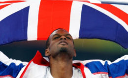  Germaine Mason of Britain celebrates after finishing second in the men’s high jump athletics final during the Beijing 2008 Olympic Games at the National Stadium August 19, 2008 (REUTERS/Gary Hershorn) 