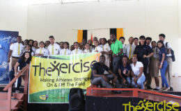 Students of Queen’s College posing with members of The Xercise, following the conclusion of a school visit, part of local observances for the UN’s International Day of Sport for Development and Peace.