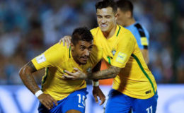 Uruguay v Brazil - World Cup 2018 Qualifier -23/3/17 - Brazil’s Paulinho (L) celebrates his second goal with teammate Phillipe Coutinho (REUTERS/Andres Stapff )

