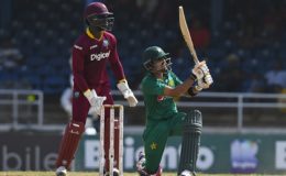Wicketkeeper Chadwick Walton looks on as Babar Azam clears the ropes during his knock of 38 on Sunday. (Photo courtesy WICB Media)