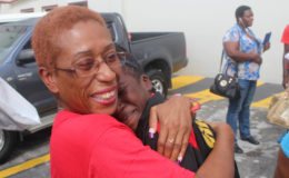 There was no better welcome for CARIFTA Games athlete Chantoba Bright than the warm embrace she received after leaving the VIP Lounge at the Cheddi Jagan International Airport to find her loved ones awaiting her arrival. Bright captured the gold medal in the long jump and received a bronze medal in the triple jump. Bright, all smiles at the time, said she was overwhelmed by the welcome since although she has represented Guyana more than once at the international level, she has never received such a welcome before. See more photos of the team’s return on centre pages. (Photo by Keno George) 
