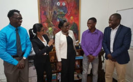 Minister of Sport Nicolette Henry chats with members of the new executive of the Guyana Chess Federation during a courtesy call last week. From Left, Frankie Farley, Yolander Persaud, Anthony Drayton and James Bond.