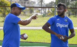 Rajindra Dhanraj (left) makes a point to leg-spinner Devendra Bishoo during a recent training session ahead of the opening One-Day International. (Photo courtesy WICB Media) 
