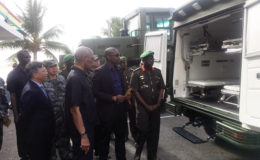 From left Chinese Ambassador to Guyana Cui Jianchun, President David Granger, Minister of Public Infrastructure David Patterson and GDF Chief of Staff Patrick West along with others inspecting one of the off-road ambulances. 