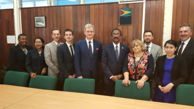 Attorney General Basil Williams (sixth from left) with the ECGI team and others. (Ministry of Legal Affairs photo)