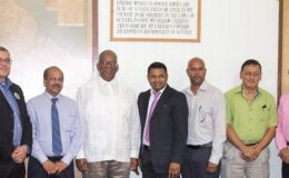 From left are Godfrey Statia, Dr Gobin Ganga, Winston Jordan, Deodat Indar and members of the Chamber team 