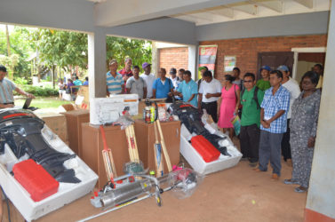 Residents of the various communities in Mabaruma standing alongside the equipment they received from the Ministry of Indigenous Peoples’ Affairs. (GINA photo)